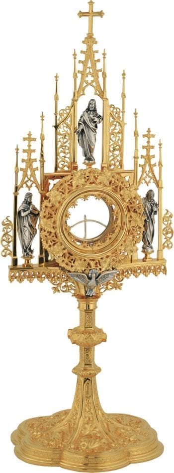 French Gothic style monstrance, an authentic jewel of sacred art, embellished with Gothic decorations and statues of the Virtues in the pinnacles of the reliquary