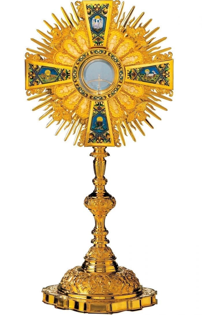 24 carat gold monstrance in baroque style, precious for the royal finish and the richness of the decorations. Entirely hand-engraved and fire-enameled with the cloisonné technique.