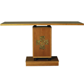 Wooden altar decorated with the frieze of a stylized golden brass cross on the front