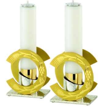 Modern two-tone brass candlestick complete with fake chiseled candle with Eucharistic symbols