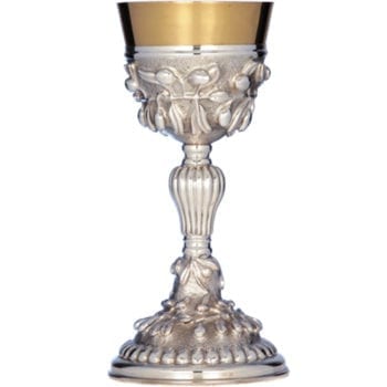 "Ulivo" chalice in hand-chiseled silver with cantilevered motifs of olive leaves and ogives at the handle