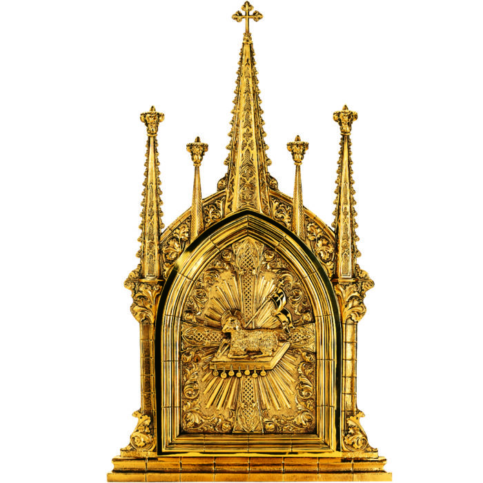 Golden altar tabernacle hand made in gothic style richly decorated with symbols of the Lamb of God and the seven Seals